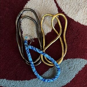 3 necklaces. 2 snake twisty, could be bracelets. 1 crochet hand beaded necklace